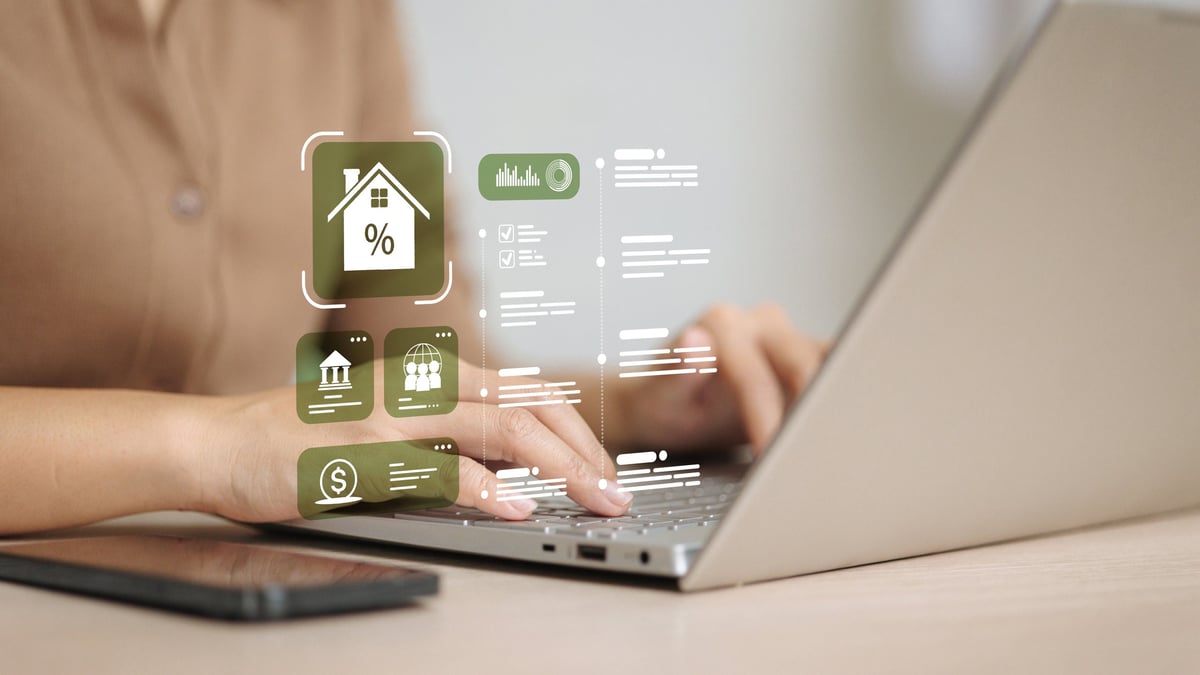 Adult homebuyer types on laptop with mortgage interest icons to compare rates and apply online.