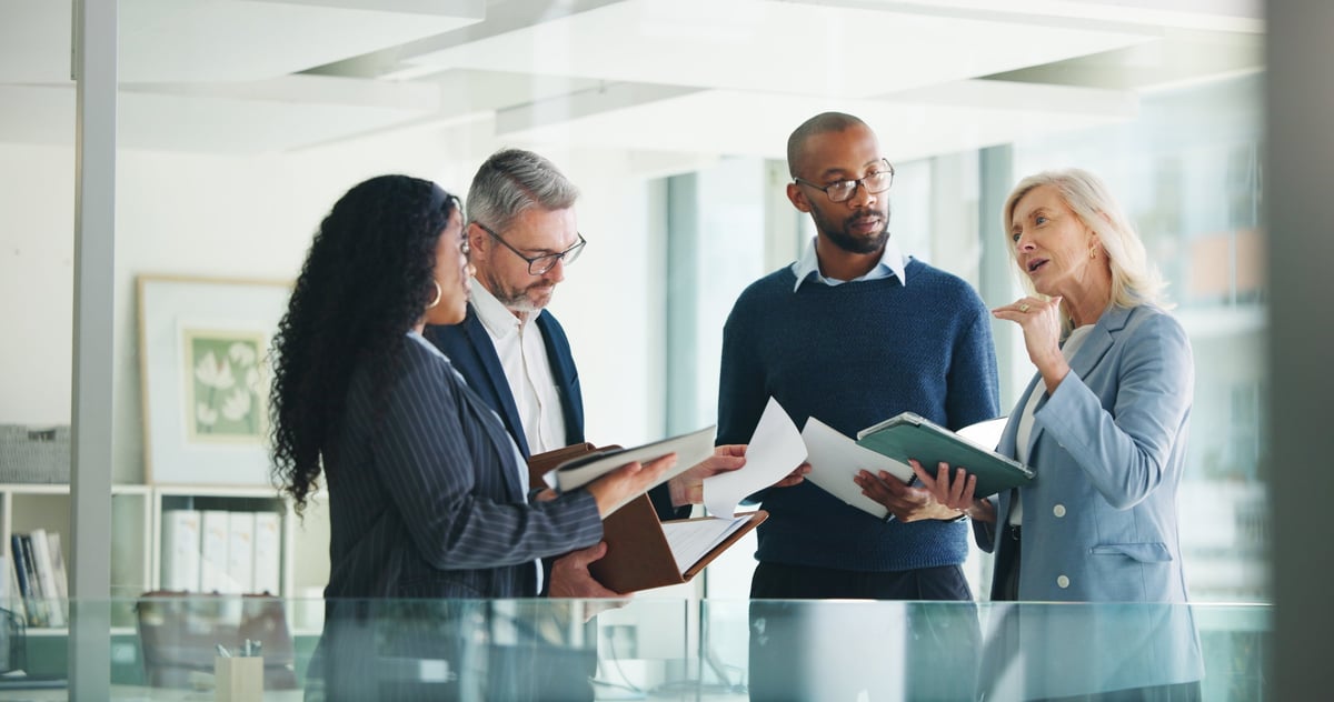 Business, documents and people with meeting discussion for finance trends, policy decision or update