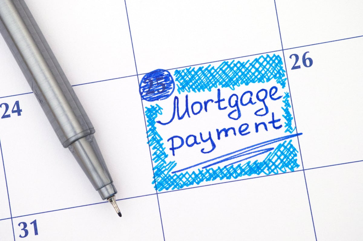 Reminder Mortgage Payment in calendar with blue pen.